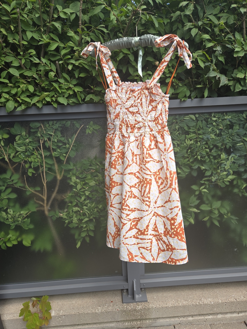 LINEN Nikole Miller Smocked Tie-Shoulder Mini Dress in Pink and Cream US S